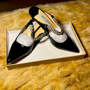 Black patent leather, bare back (kitten heels) dress shoes, size 8.